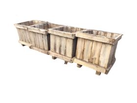 A set of four boarded garden boxes with mesh bases. (29in x 27in x 27.75in) (4)