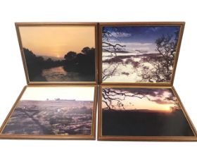 A set of four framed oleographic Northumberland landscape photographs - Dunstanburgh, Coquet sunset,