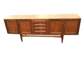 A mid-century G-Plan teak Fresco sideboard designed by Victor Wilkins, with four central drawers