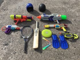 Miscellaneous childrens sports and games equipment including four water guns, a riding hat, a