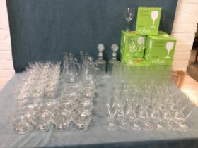 Miscellaneous glass including boxed wine glasses, flutes, sets of drinking glasses, a pair of ribbed