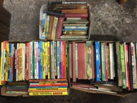 Three boxes of childrens books including boys & girls annuals, comics, novels, observer titles,