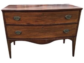A Georgian bowfronted chest of drawers, mounted with two graduated boxwood strung drawers with