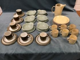 Three sets of Poole Pottery - a green glazed soup set, a fawn spatter decorated ribbed suite, and an