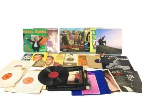 A collection of vinyl records including Elvis Presley, Marlene Dietrich, musicals, the Beatles Sg