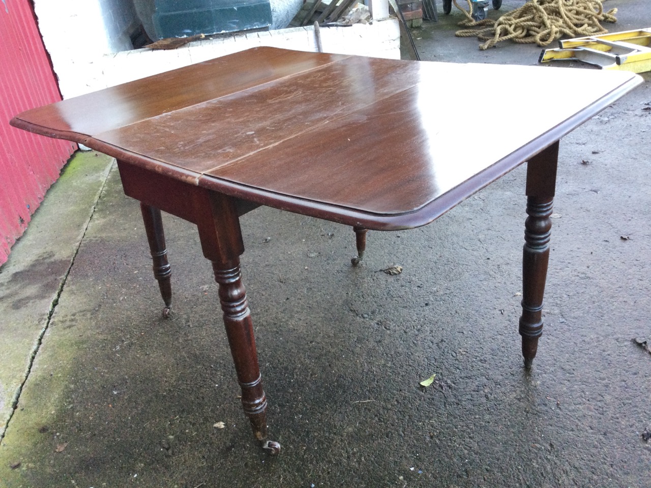 A Victorian mahogany drop leaf dining table, the moulded rectangular top with two leaves opening - Image 3 of 3