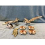 A set of four Victorian oval silver plated salts with gadrooned rims on paw feet; a pair of pheasant