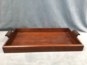 A Chinese rectangular rosewood butlers tray, the handles carved with prunus blossom in relief. (30.