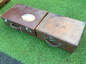 A C20th leather suitcase with chrome mounts, having 30s Cunard Line label to lid; and an earlier