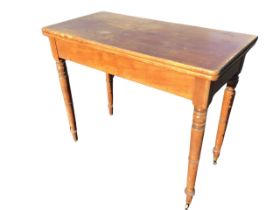 A Victorian mahogany turn-over-top tea table, the rectangular rounded twin leaves revolving above