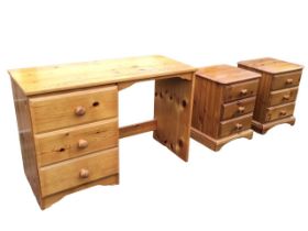 A pine dressing table with rectangular top above a kneehole and a pedestal of three moulded