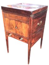 A Georgian mahogany washstand converted to a writing table, the top opening to a stationery rack and