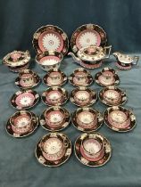 A regency porcelain tea and coffee service - handpainted with borders of roses & gilt foliage on a