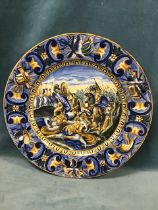 A 19th century Italian maiolica charger in the Urbino style, decorated with a roman battle scene