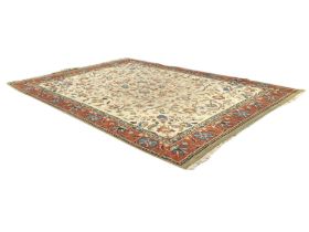 A Wilton Persian style carpet, the cream field with an allover scrolling floral and foliate