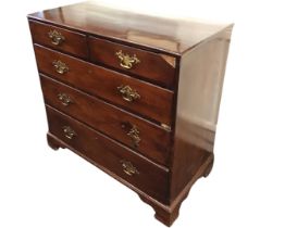 A nineteenth century mahogany chest of drawers, with two short and three long graduated drawers