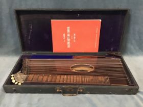 A leather cased 19th century rosewood and boxwood-strung zither by Gunther & Mornstein of Mittenwald