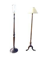 An octagonal tapering standard lamp with column on a fluted baluster with scroll carved tripartite