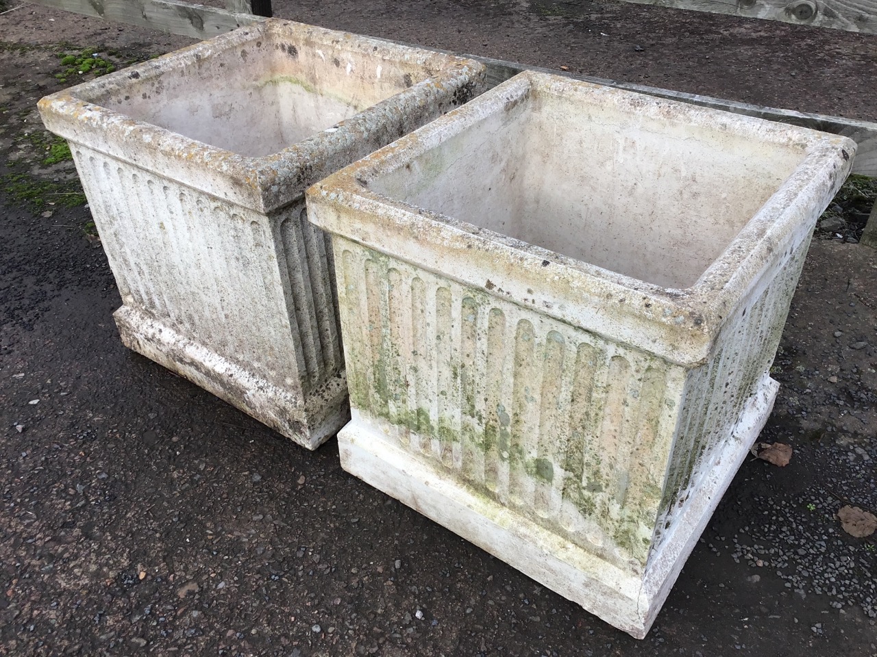A pair of large square composition stone garden urns with fluted sides and moulded rims. (17.75in - Bild 2 aus 3