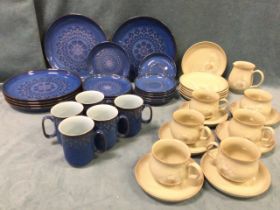 A Denby stoneware dinner service with stylised floral decoration in dark blue glaze; and a Denby tea