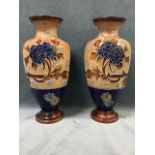A pair of Doulton Lambeth stoneware vases, with tubelined decoration of peonies and flowerheads by
