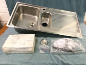 A German stainless steel sink unit by Franke, with two bowls & drainer, complete with unused waste