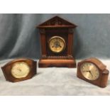 An Edwardian walnut mantel clock, the architectural case with pedimented top above a carved