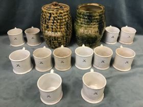 A set of twelve Victorian Scottish mugs with scrolled handles and moulded bases, printed with