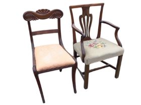 A Georgian style mahogany elbow chair with pierced splat and shaped arms above a needlework seat,