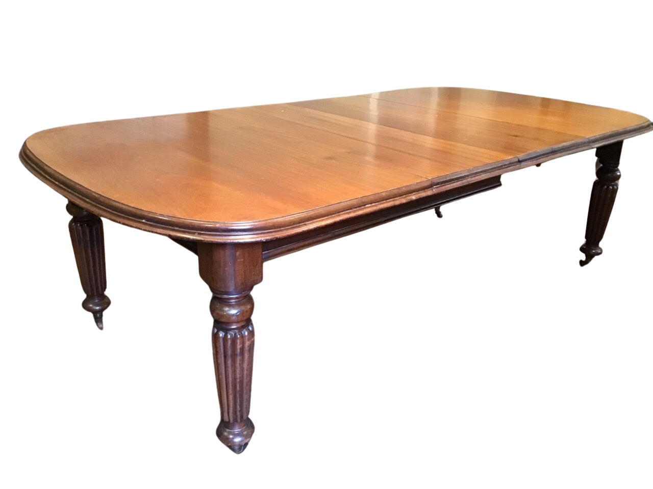 A Victorian mahogany wind-out dining table, the rounded moulded top with three leaves, raised on - Image 2 of 3