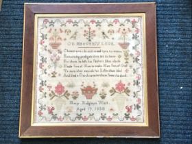 A square William IV sampler dated 1830 sewn by Mary Widgley, with vases of flowers, birds and