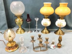 A pair of brass and ceramic tablelamps with glass shades in the form of oil lamps; another brass