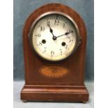 An Edwardian mahogany mantel clock, the arched case with inlaid satinwood fan motif and moulded base