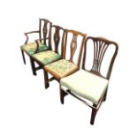 A pair of mahogany Chippendale style chairs - a carver and a single, with scalloped rails above