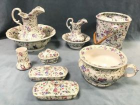 A late Victorian Minton extensive wash set with a graduated pair of jug & basins, a slop pail with