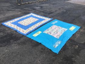 Two mid-century double-sided patchwork quilts, sewn in plain and printed cottons. (76.5in x 50in &