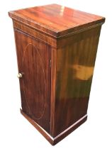 An Edwardian mahogany bedside pot cupboard inlaid with boxwood stringing, with brass knobbed door,