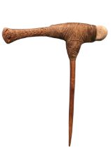 A New Guinea Whagi double headed ceremonial axe, the rounded stone and flared wood blade with