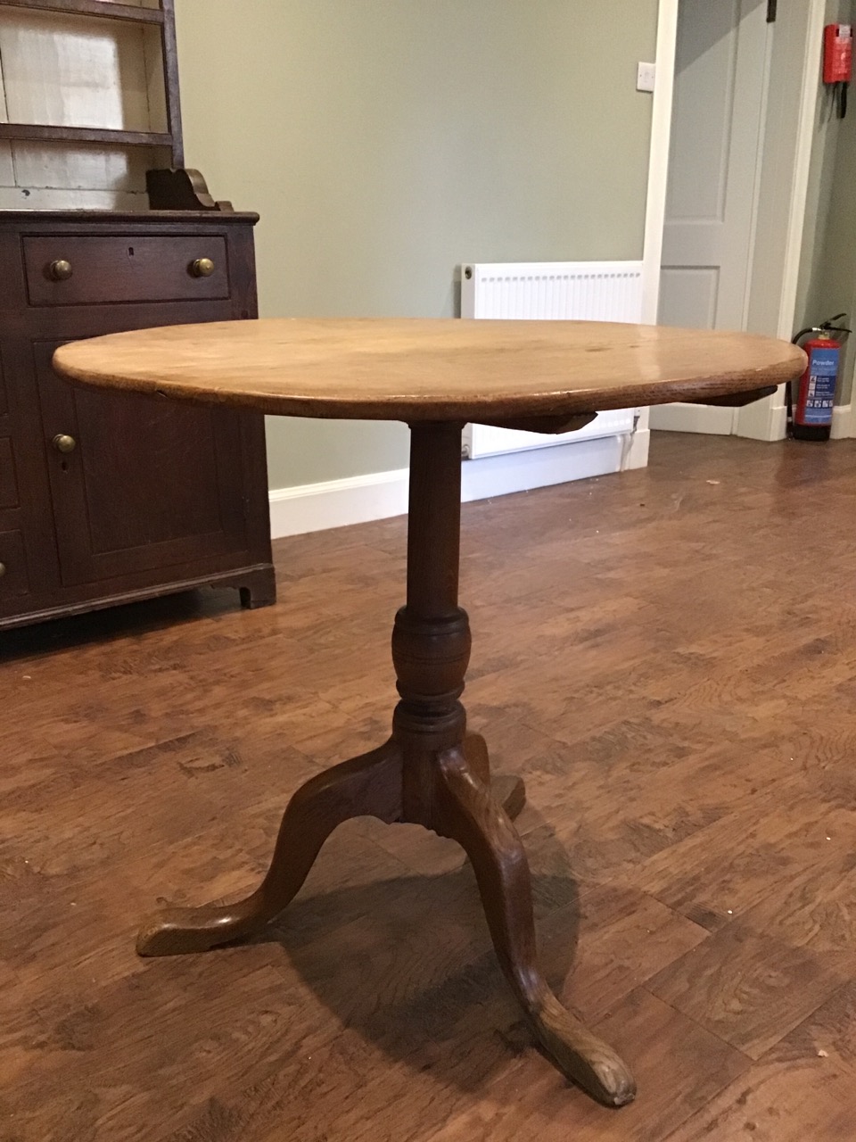 A circular Georgian oak snap-top occasional table supported on a turned column, with tripartite legs - Image 3 of 3