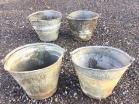 Four elliptical galvanised buckets with swing handles - numbered and embossed Ideal. (4)