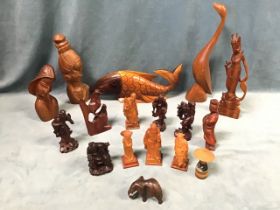 A collection of carved wood figures - a small Japanese doll, Chinese Buddhist deities, a large carp,