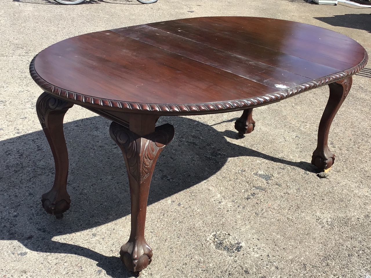 A late Victorian mahogany extending dining table with two leaves, the oval top with gadrooned edge - Image 2 of 3