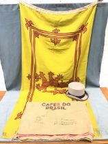 A Scottish lion rampant flag - 74in x 36in; a grey top hat size L; and a Cafés do Brasil printed