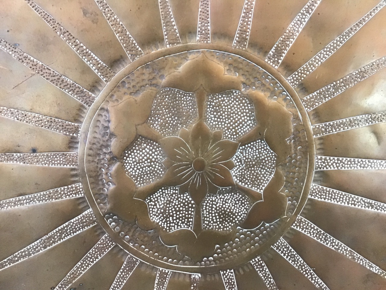 An Edwardian hand-beaten art nouveau copper tray, with central flowerhead and sunburst motif - Image 2 of 3