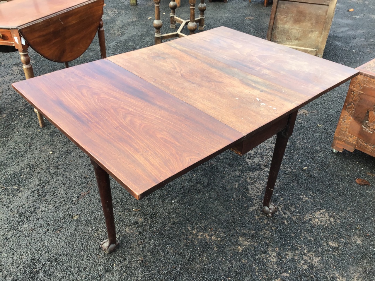 A George III mahogany drop-leaf dining table, the rectangular top with two leaves opening on swing - Image 2 of 3