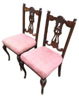 A pair of Edwardian mahogany parlour chairs, the crestrails and splats carved in art nouveau