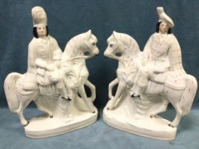 A pair of nineteenth century Staffordshire flatback figures modelled as Scottish couple on