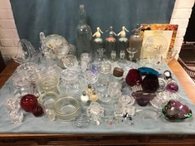 Miscellaneous glass including a Bells bottle, a Murano bowl, decanters, vases, bowls, preserve &