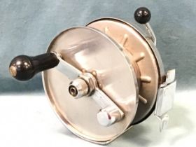 A large Allcock & Co Ltd of Redditch sea fishing reel with 6in drum and side lever brake. (6.5in)