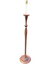 A regency style mahogany standard lamp, the candle form light fitting above a turned drip pan and